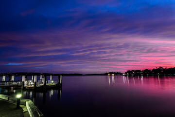 Fototapeta na wymiar Colorful dawn clouds on Sydney Harbour