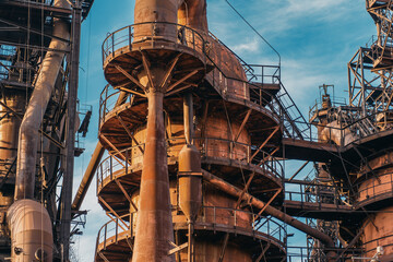 Metallurgical plant blast furnace and smokestacks. Industrial iron background