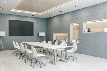 Minimalistic conference room with blank tv screen.