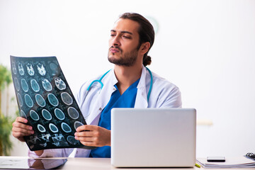 Young male doctor radiologist working in the clinic