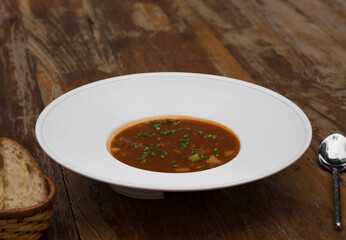 Hearty beef goulash soup served with toasted bread