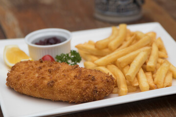 Pork Cordon Bleu served with French fries and Cranberrry Sauce