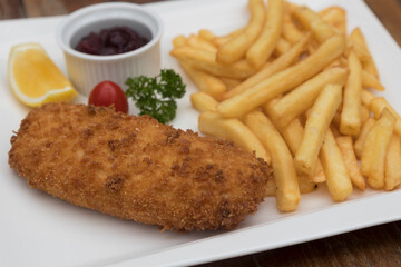 Pork Cordon Bleu served with French fries and Cranberrry Sauce