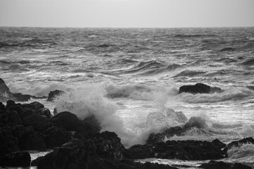 Ocean crashing onto a rocky shore