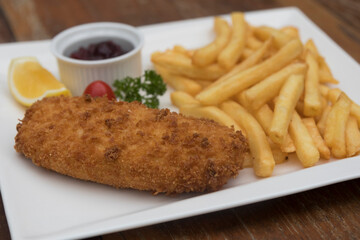 Pork Cordon Bleu served with French fries and Cranberrry Sauce