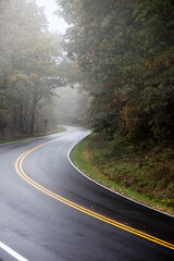 Mountain road into the fog