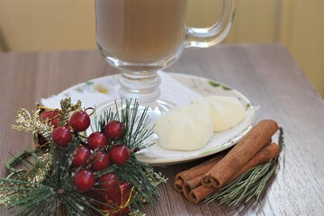 christmas table setting with coffee and cinnamon