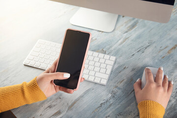 woman working smart phone and computer
