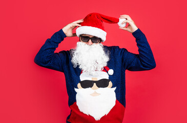 Everyone will get a present. just have fun. happy bearded mature man in santa hat. new year party....