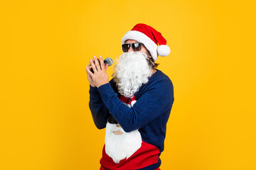 happy bearded man in santa claus costume singing in microphone celebrate winter holiday of chistmas and feel merry about xmas gifts, christmas karaoke