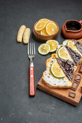 front view cake slices with chocolate and fruits on the dark background dessert pie cake sweet