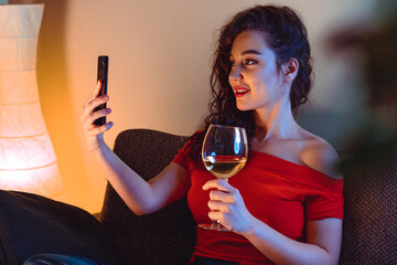 Woman Calling Her Friend By Video Chat And Drinking Wine. Online Date, Online Meeting With Friends. Stay Home. Social Distance, Isolation