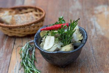 Pickled artichokes served with toasted bread