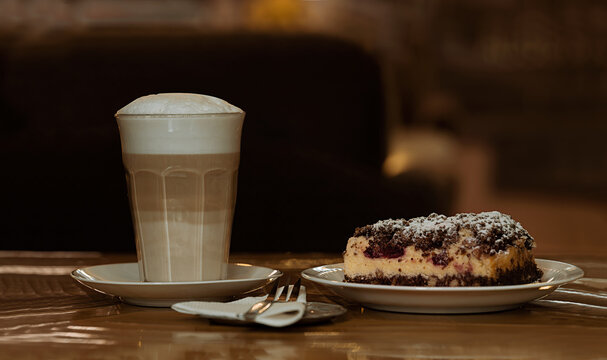 latte macchiato and piece of homemade cake
