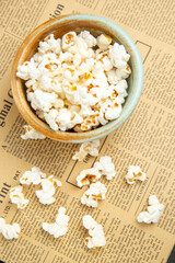 Fototapeta na wymiar top view fresh popcorn inside plate on dark background snack movie cinema food corn