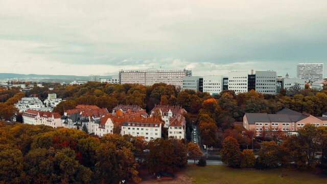 Aerial ascending shot of the University Medical Center building with modern flats behind in Mainz germay city