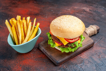 front view tasty meat burger with french fries on the dark background sandwich fast-food bun
