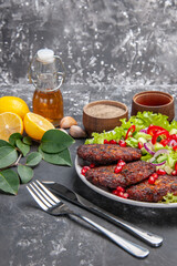 front view delicious meat cutlets with fresh salad on grey background photo food meal dish
