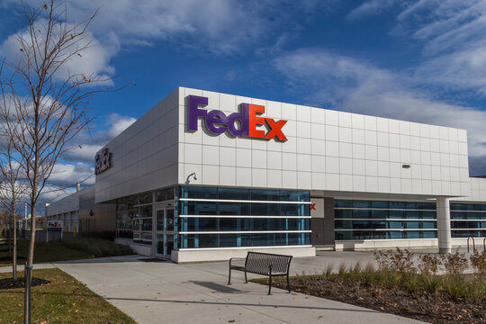 TORONTO, CANADA - NOVEMBER 19, 2017: FedEx logo on the building of FedEx Ship Centre in Toronto. FedEx Corporation is an American multinational courier delivery services company 
