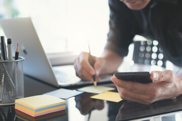 Startup business. Business workers posting with sticky notes stickers reminders creative brainstorming in modern office