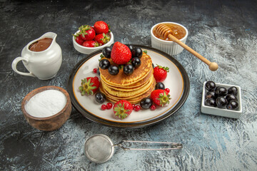 front view yummy pancakes with fresh fruits on light background fruit cake sweet