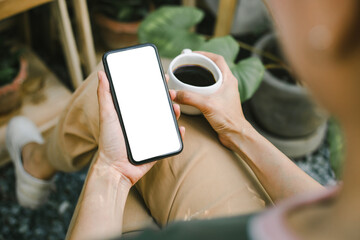 cell phone blank white screen mockup.woman hand holding texting using mobile on desk at office.background empty space for advertise.work people contact marketing business,technology
