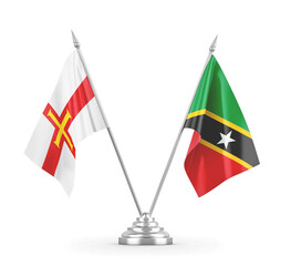 Saint Kitts and Nevis and Guernsey table flags isolated on white 3D rendering