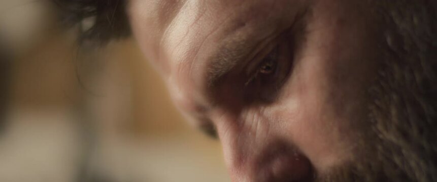 Close up of a bearded hispanic chef working in the kitchen. Slow motion.