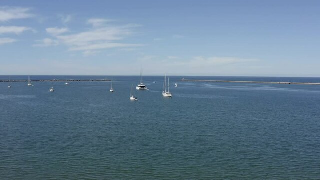 Boats of every shape and size out in the harbor at Praia Do Mohle, Portugal