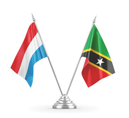 Saint Kitts and Nevis and Luxembourg table flags isolated on white 3D rendering