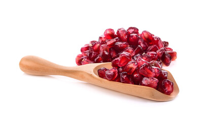 Fruit pomegranate in wood scoop on white background