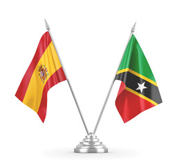 Saint Kitts and Nevis and Spain table flags isolated on white 3D rendering
