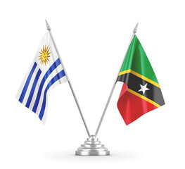 Saint Kitts and Nevis and Uruguay table flags isolated on white 3D rendering