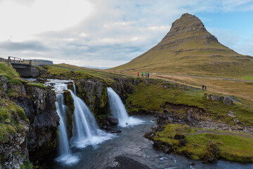 Obraz premium Kirkjufell Mountain with waterfalls. Kirkjufell is a 463 m high mountain on the north coast of Iceland's Snæfellsnes peninsula.