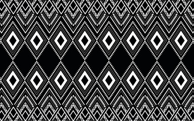 Ethnic geometric print pattern design  Aztec repeating background texture in black and white. Fabric, cloth design, wallpaper, wrapping