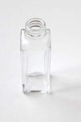 clean glass bottle isolated on white background