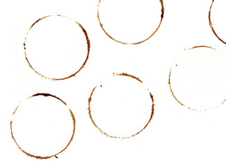 brown shapes of  Coffee ring stains. Wine glass marks or coffee cup round stains and dirty splashes and spots isolated. Hand drawn tea or ink ring stains on white background