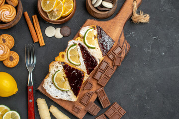 top view cake slices with cookies and chocolate on dark background sweet cake dessert