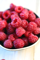 Fresh juicy raspberries in a bowl. Dessert berry raspberry.