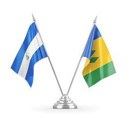 Saint Vincent and the Grenadines and Nicaragua table flags isolated