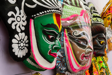 Colorful chhou masks of men on display for sale at handicrafts fair, Kolkata, West Bengal, India.