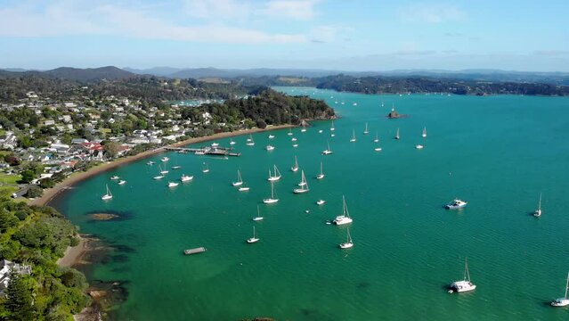 Aerial orbit reveal beautiful scenery of Bay of Islands. Summer day in Russell, New Zealand. Good colorful light.