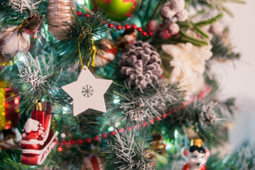 Christmas Interior. Decorated Christmas tree. Wreath of Christmas tree branches. Garland. Lights. Christmas decorations. Christmas mood.