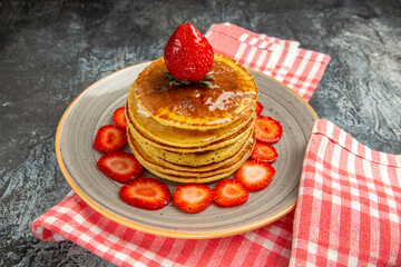 front view yummy pancakes with honey and fruits on light background milk sweet fruit cake