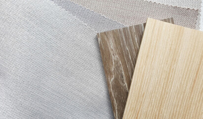 light beige and brown wooden veneer samples matching color with interior fabric zigzag pattern texture samples. fabric strip line ,herringbone pattern design,upholstery for decoration interior design.