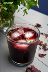 Jamaica water with dried flowers and mint also called Hibiscus tea