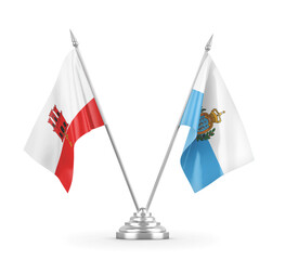 San Marino and Gibraltar table flags isolated on white 3D rendering