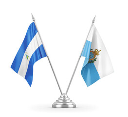 San Marino and Nicaragua table flags isolated on white 3D rendering