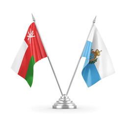 San Marino and Oman table flags isolated on white 3D rendering