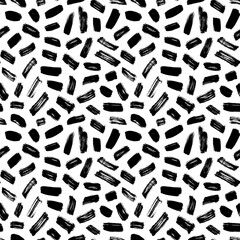 Brush strokes vector seamless pattern. Black paint freehand scribbles, small lines, dry brush stroke texture. Chaotic rough smears. Black and white mosaic texture. Hand drawn grunge ink illustration.